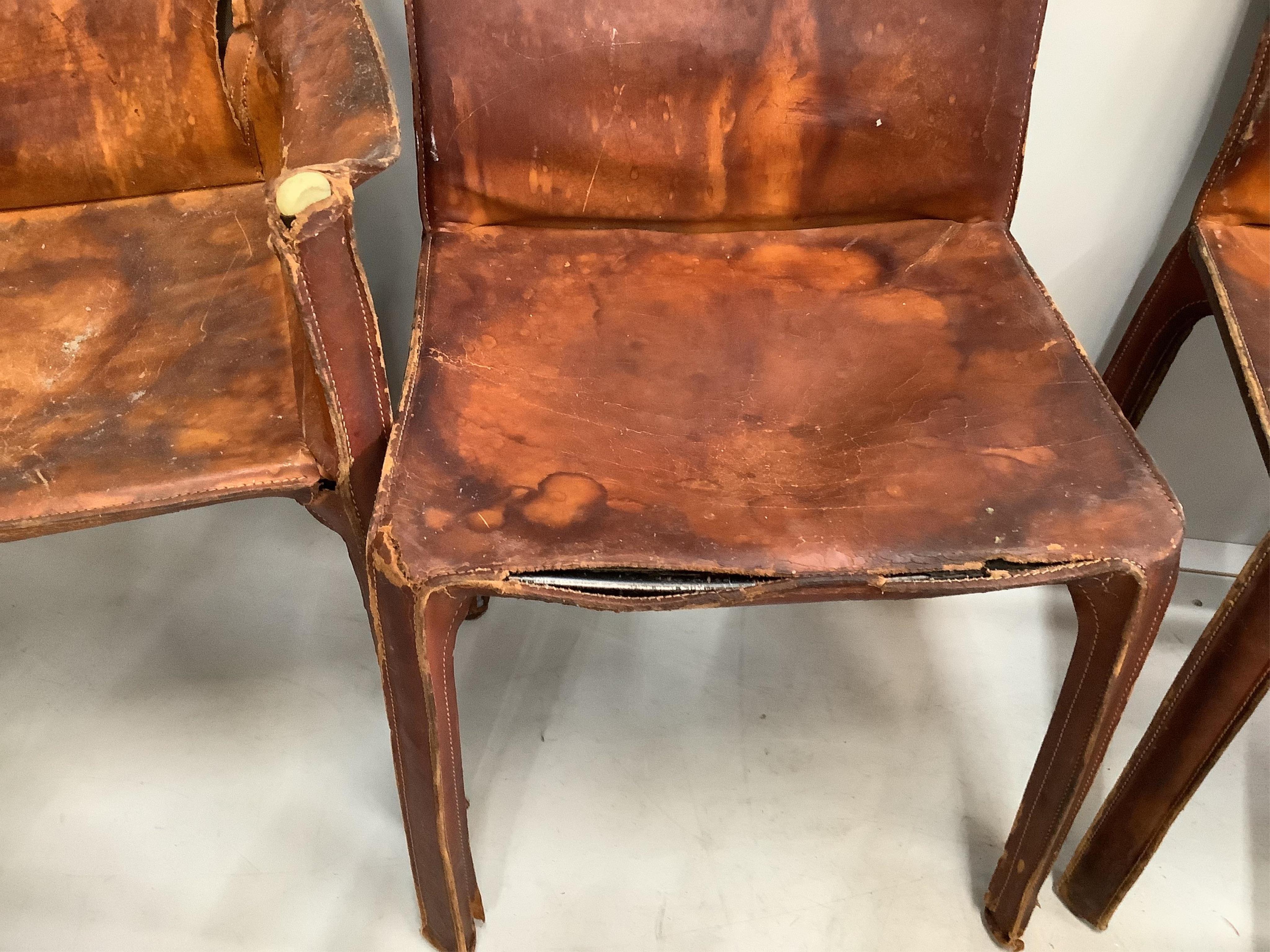 Mario Bellini, a set of six cognac leather lounge chairs, two with arms, larger width 60cm, depth 45cm, height 80cm. Condition - poor to fair